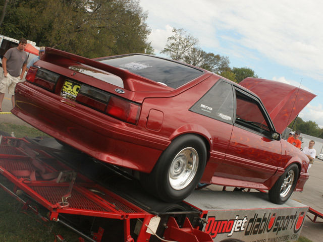 Custom Wild Strawberry with Candy Orange Flames 1991 Ford Mustang Hatchback with Gray interior