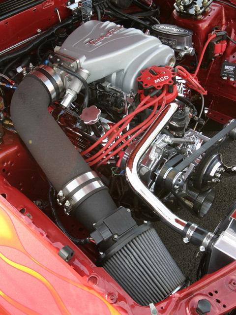 Custom Wild Strawberry with Candy Orange Flames 1991 Ford Mustang Hatchback with Gray interior
