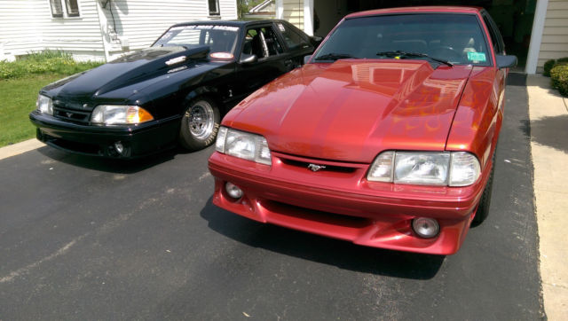 Custom Wild Strawberry with Candy Orange Flames 1991 Ford Mustang Hatchback with Gray interior