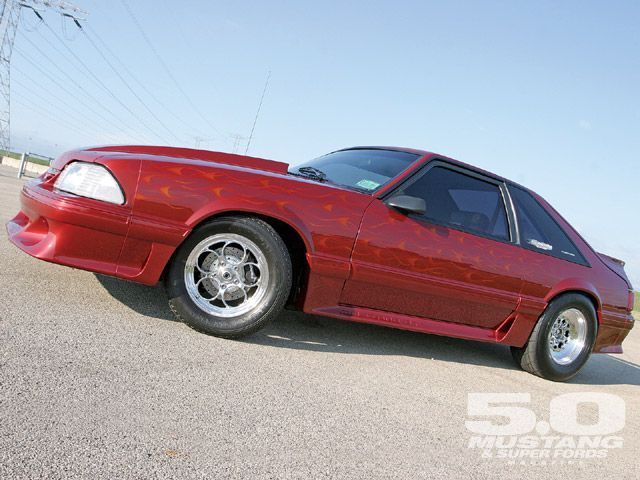 Custom Wild Strawberry with Candy Orange Flames 1991 Ford Mustang Hatchback with Gray interior