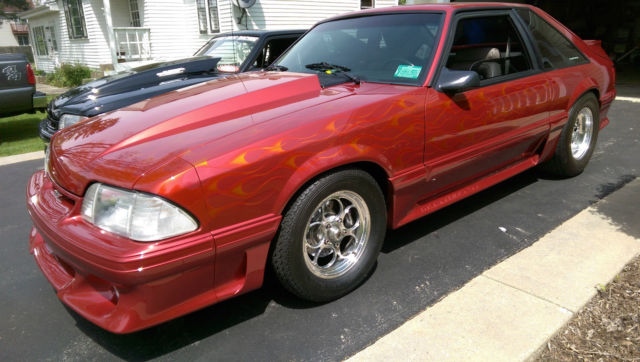 Custom Wild Strawberry with Candy Orange Flames 1991 Ford Mustang Hatchback with Gray interior