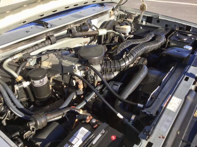 Silver 1992 Ford Bronco SUV with grey interior