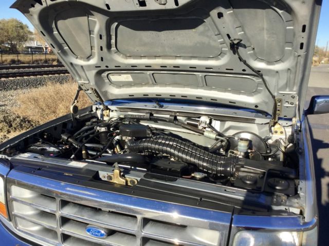 Silver 1992 Ford Bronco SUV with grey interior