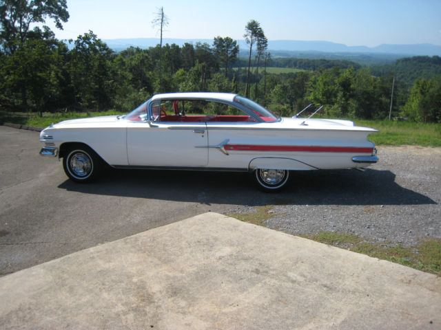 White 1960 Chevrolet Impala Hardtop with red interior