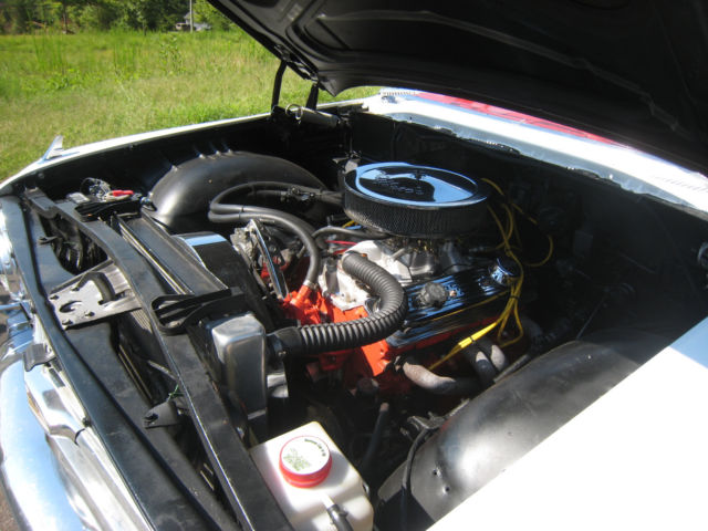 White 1960 Chevrolet Impala Hardtop with red interior