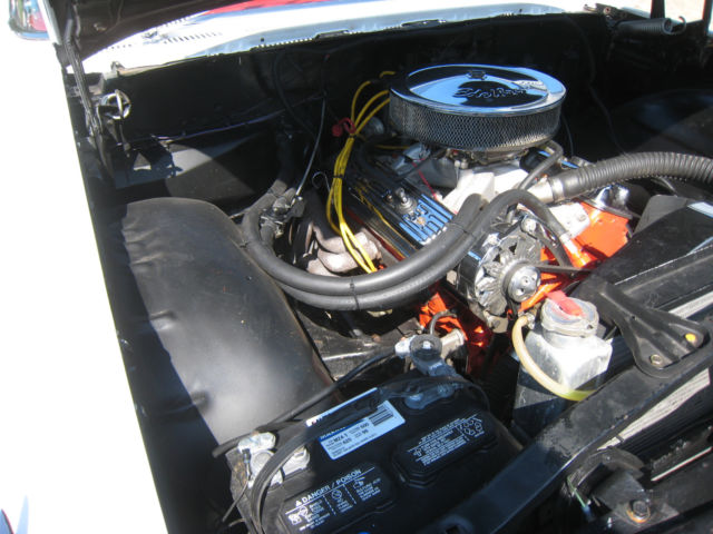 White 1960 Chevrolet Impala Hardtop with red interior