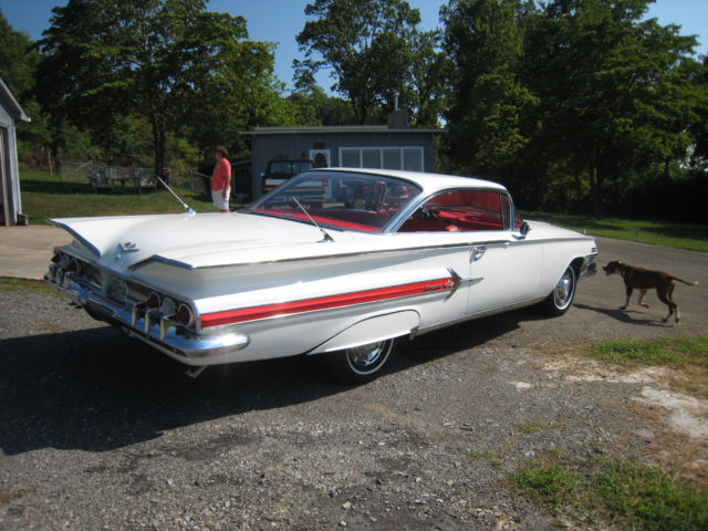 White 1960 Chevrolet Impala Hardtop with red interior