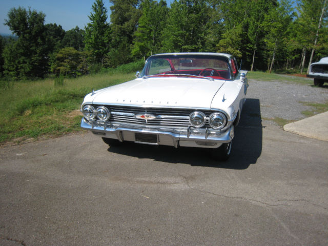 White 1960 Chevrolet Impala Hardtop with red interior