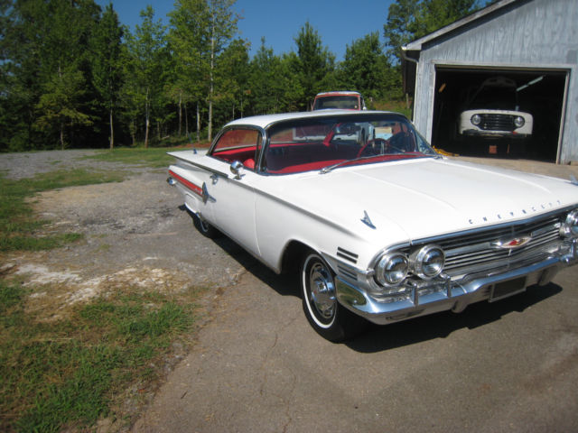 White 1960 Chevrolet Impala Hardtop with red interior