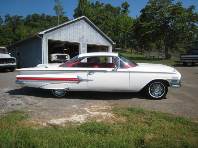 White 1960 Chevrolet Impala Hardtop with red interior