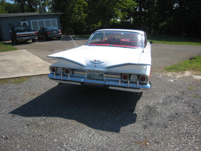 White 1960 Chevrolet Impala Hardtop with red interior