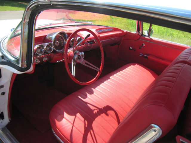 White 1960 Chevrolet Impala Hardtop with red interior