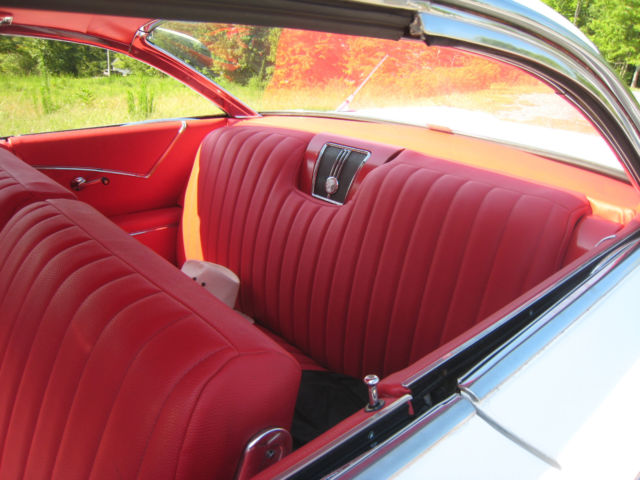 White 1960 Chevrolet Impala Hardtop with red interior