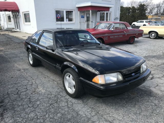 Black 1993 Ford Mustang Hatchback with Red interior