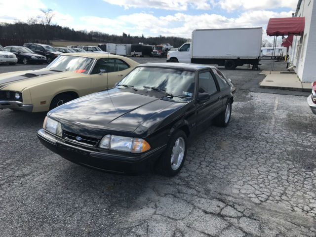 Black 1993 Ford Mustang Hatchback with Red interior