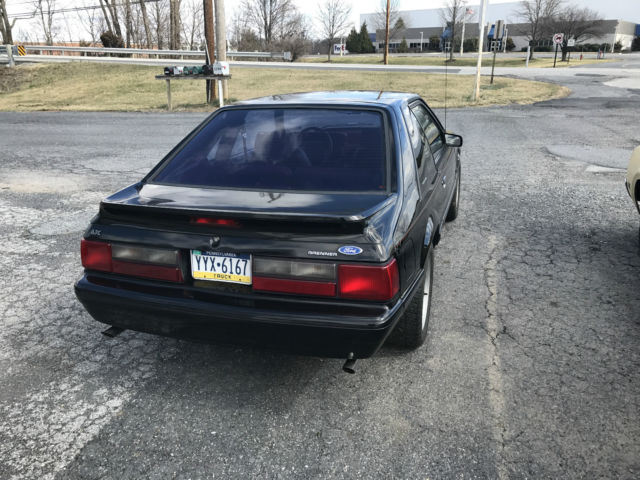Black 1993 Ford Mustang Hatchback with Red interior