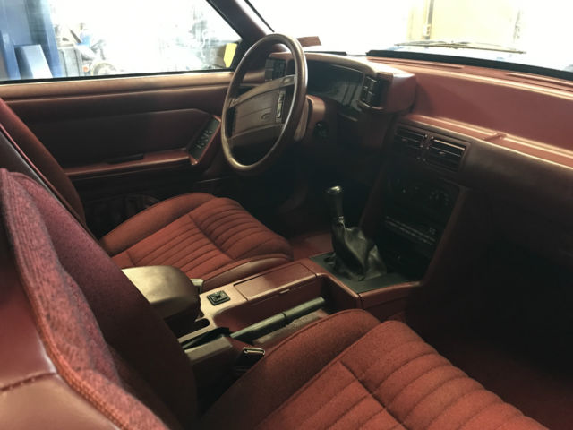 Black 1993 Ford Mustang Hatchback with Red interior