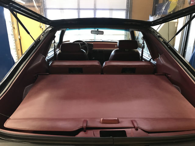 Black 1993 Ford Mustang Hatchback with Red interior