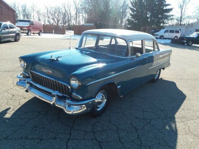 Blue and creme 1955 Chevrolet Bel Air/150/210 Sedan with blue interior