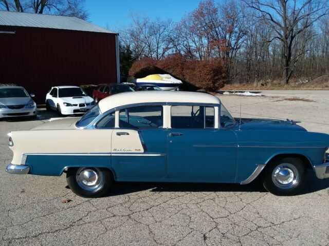 Blue and creme 1955 Chevrolet Bel Air/150/210 Sedan with blue interior