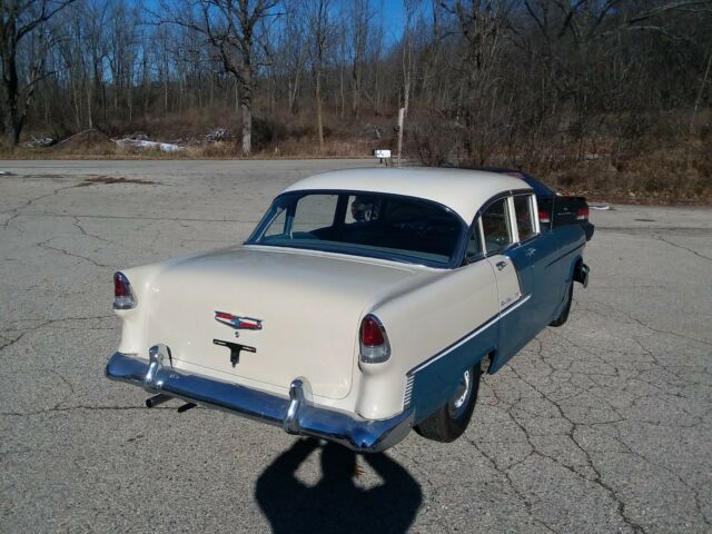 Blue and creme 1955 Chevrolet Bel Air/150/210 Sedan with blue interior