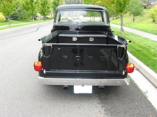 black 1956 Ford F-100 with grey interior