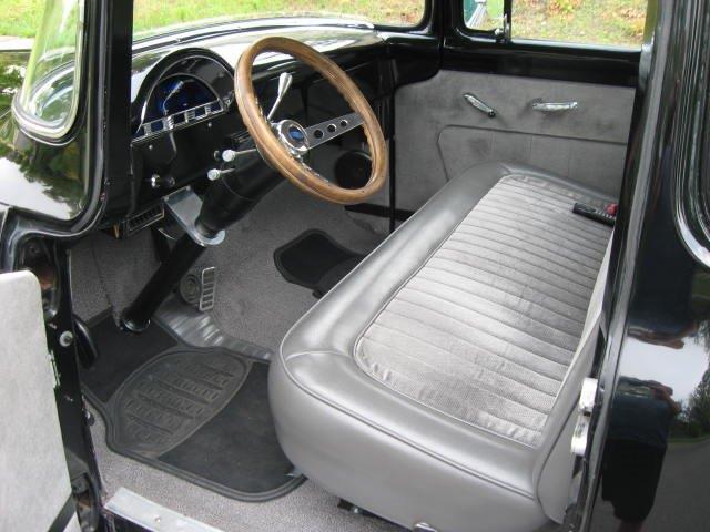 black 1956 Ford F-100 with grey interior