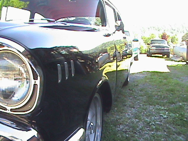 Black and Grey 1957 Chevrolet Bel Air/150/210 2 door post with Red interior