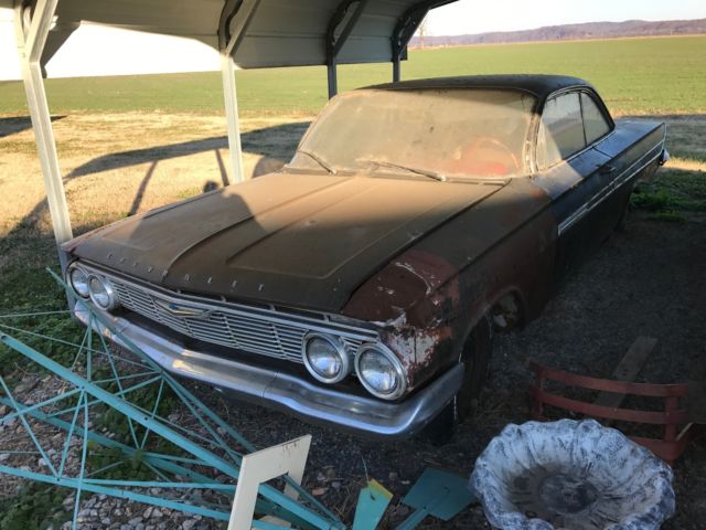 Black 1961 Chevrolet Impala 2 door with Red interior