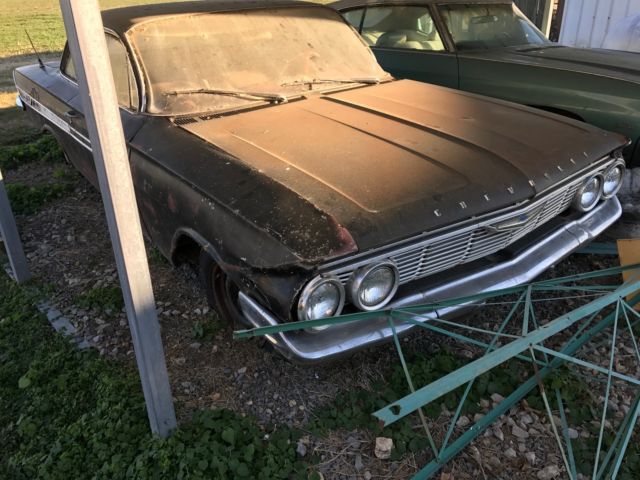 Black 1961 Chevrolet Impala 2 door with Red interior
