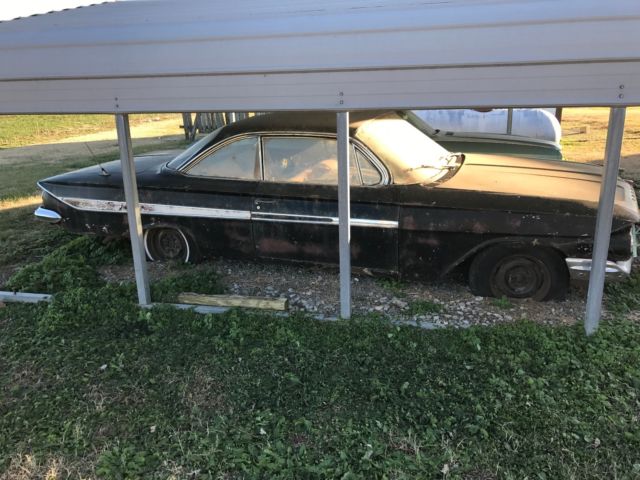 Black 1961 Chevrolet Impala 2 door with Red interior