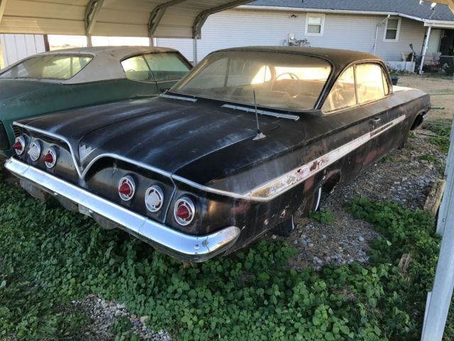 Black 1961 Chevrolet Impala 2 door with Red interior