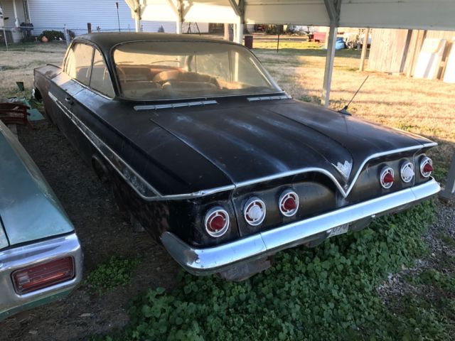 Black 1961 Chevrolet Impala 2 door with Red interior