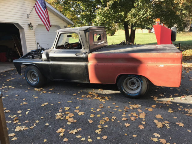 Black 1964 Chevrolet C-10 pickup with Burgundy interior