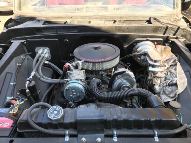 Black 1964 Chevrolet C-10 pickup with Burgundy interior