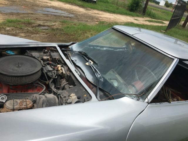 Silver 1974 Chevrolet Corvette Coupe with Red interior