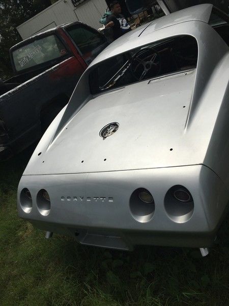 Silver 1974 Chevrolet Corvette Coupe with Red interior