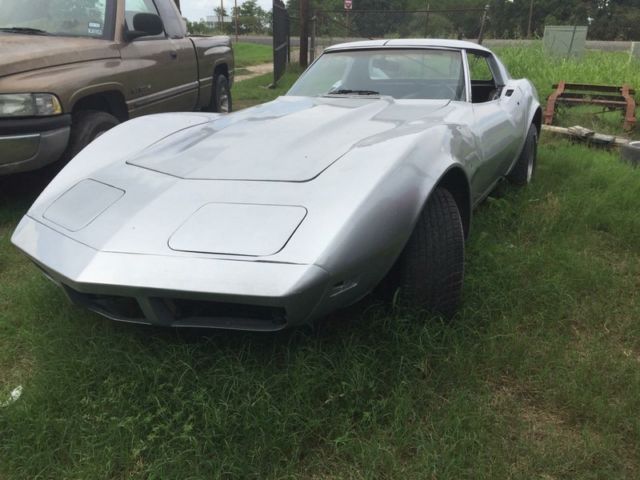 Silver 1974 Chevrolet Corvette Coupe with Red interior