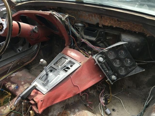 Silver 1974 Chevrolet Corvette Coupe with Red interior