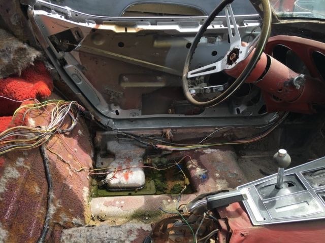 Silver 1974 Chevrolet Corvette Coupe with Red interior