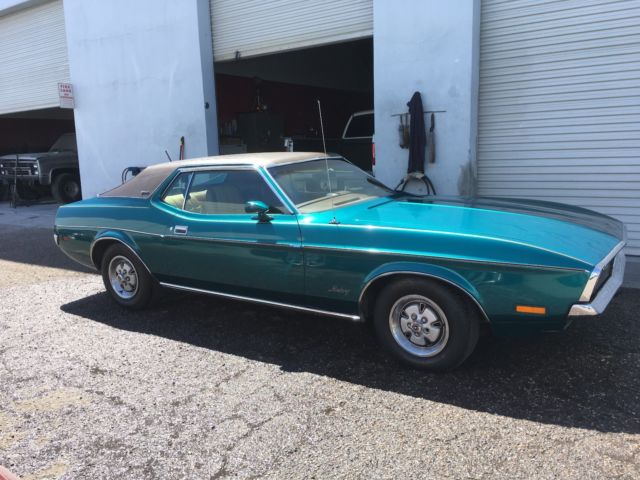 Green 1972 Ford Mustang Coupe with Tan interior