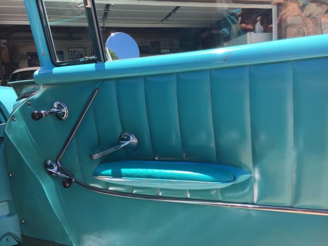 turquoise and India Ivory 1957 Chevrolet Bel Air/150/210 sedan with turquoise interior