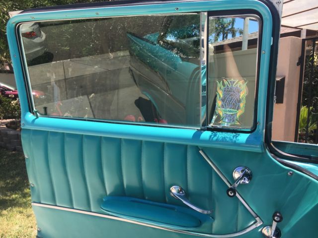 turquoise and India Ivory 1957 Chevrolet Bel Air/150/210 sedan with turquoise interior