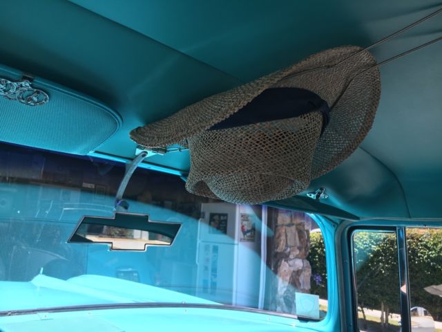 turquoise and India Ivory 1957 Chevrolet Bel Air/150/210 sedan with turquoise interior