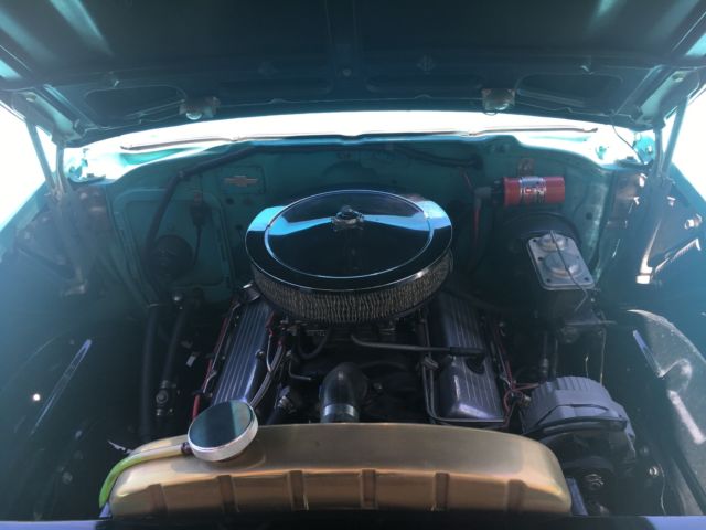 turquoise and India Ivory 1957 Chevrolet Bel Air/150/210 sedan with turquoise interior