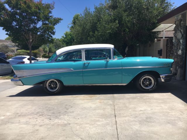 turquoise and India Ivory 1957 Chevrolet Bel Air/150/210 sedan with turquoise interior