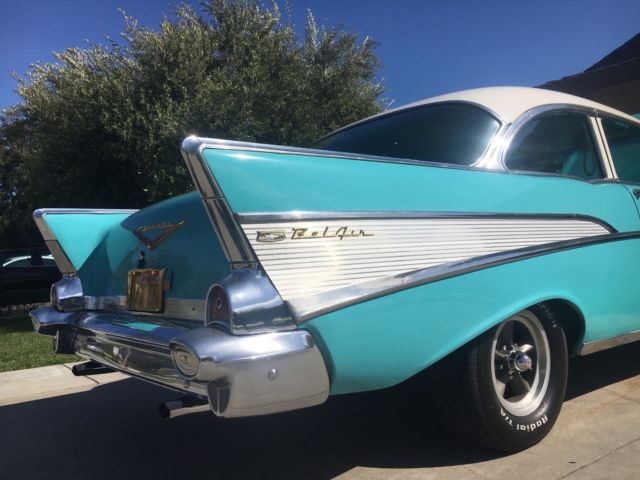turquoise and India Ivory 1957 Chevrolet Bel Air/150/210 sedan with turquoise interior