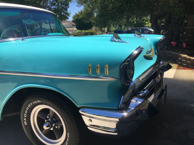turquoise and India Ivory 1957 Chevrolet Bel Air/150/210 sedan with turquoise interior