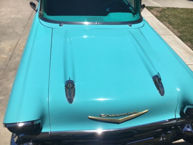 turquoise and India Ivory 1957 Chevrolet Bel Air/150/210 sedan with turquoise interior