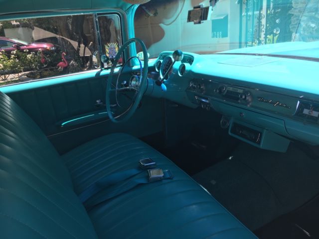 turquoise and India Ivory 1957 Chevrolet Bel Air/150/210 sedan with turquoise interior
